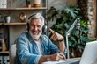 © Ratko - Senior man recording podcast and having fun at home