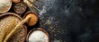 © djmaxx24 - Top view of different grains and separately in wooden bowls on dark background, with wheat ears and other grain flour scattered around