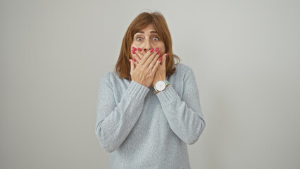 Poster - Middle-aged woman with short hair, covering mouth with hands, expressing surprise against a white background.