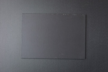 Sticker - blank black notebook on shine black background