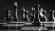 © Flowaiart - Black and white image of chess pieces on a chessboard. The king piece is in focus, symbolizing strategy and leadership.