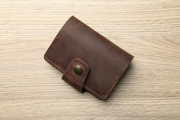 Wall Mural - Leather business card holder on wooden table, top view