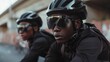 © GoodandEvil - Cyclists with helmets riding on a road