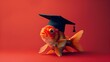 © vanilnilnilla - Solitary Goldfish Wearing Graduation Cap and Gown on Red Backdrop