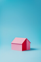 Wall Mural - minimalistic pink house on a blue background, isometric visualization.Minimal creative real estate concept.Top view