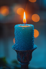 Fototapete - Elegant shot of a cyan candle burning softly against a plain background,