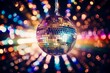 © Marina - shiny disco ball hanging on ceeling and in colourful bokeh background