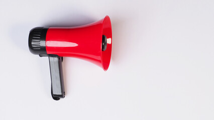 Wall Mural - Red megaphone isolated on white background..