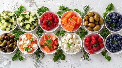 Wall Mural -  A table topped with bowls of various fruits and vegetables, alongside olives, tomatoes, cucumbers, and avocados
