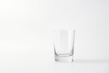 Wall Mural - Empty Glass on White Background