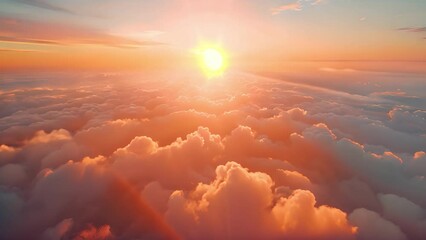 Poster - A stunning sunset over clouds from a high altitude vantage point. The sun is setting in the distance, casting warm light across the sky and clouds.