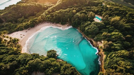 Wall Mural - Aerial view of a secluded tropical beach with turquoise waters and dense green forest surrounding the pristine coastline.