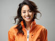 © Store at the corner - Portrait of a woman wearing a orange outfit on an isolated background with copy space