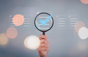 Poster - Hand holding magnifier glass with virtual paper document and correct tick sign mark for prepare check and approve of quality assurance concept.