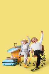 Poster - Mature business people with suitcases and beach accessories ready for summer vacation on yellow background