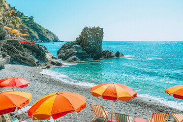 Wall Mural - Photo of Vernazza beach in Cinque Terre, Italy with colorful umbrellas and chairs on the shore overlooking an isolated rock formation, clear blue water, sunny day, picturesque landscape, in the style 