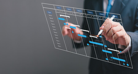 businessperson managing project schedule with digital gantt chart. modern project planning, task man