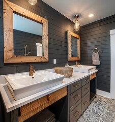 a modern farmhouse bathroom with two white sink cabinets, large wooden mirrors and dark gray shiplap