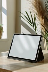 Wall Mural - A minimalist mockup of a tablet on a desk, ideal for display purposes