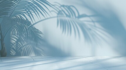 Wall Mural - 
A minimalistic composition featuring blurred palm leaf shadows on a light blue wall, perfect for product display.