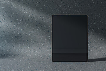 Wall Mural - A digital tablet with a blank screen on a textured grey background, concept of modern technology. 3D Rendering