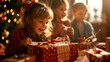 © klss777 - Children unwrap presents on Christmas morning, their faces lighting up with joy amid family warmth.