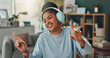 © peopleimages.com - Headphones, smile and woman with dance in home for online audio, subscription and listening to music. Happy, person and technology with internet in house for radio, streaming service or entertainment