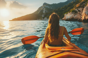 Happy young woman floating in kayak on sea. Summer holiday vacation.