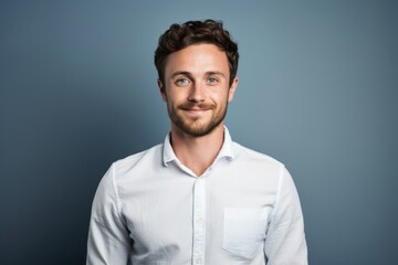 Sticker - Portrait of a glad man in his 30s wearing a simple cotton shirt in plain cyclorama studio wall