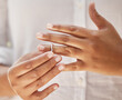 © Mdlungu/peopleimages.com - Close up of woman taking off wedding ring. Hands removing or putting on ring. Wife making hard decision to leave husband in unhappy marriage