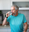© Lumos sp - kitchen man healthy morning mature breakfast active fitness water drink drinking glass thirsty fresh refreshment clean beverage diet home healthy eating senior adult healthy lifestyle