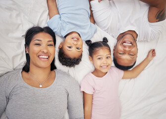 Canvas Print - Family, portrait and children on bed with support for bonding, relationship or relax together bedroom. Top view, young kids and man parent with woman for care, love or happiness in home on weekend