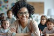 © hakule - A woman is smiling at a group of children in a classroom