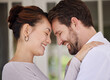 © Delcio Fernandes/peopleimages.com - Home, forehead and couple with love, smile and bonding together with happiness, romance or cheerful. People, man and woman with care, marriage or relationship with affection, trust and peace with joy