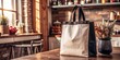 © Andrey - A white and black bag is on a table in a kitchen