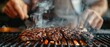 © AnuStudio - Close-up of sizzling steak on a grill with hands in the background, capturing the essence of outdoor barbecue cooking.