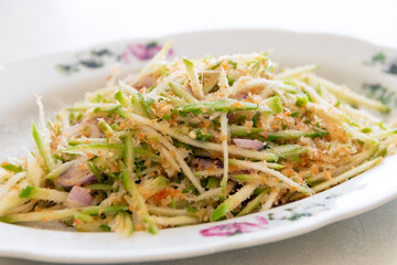 Wall Mural - Spicy Thai mango salad with fresh mango. (Songkhla Mini Mango or Ma-Muang Baw)