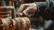 © Parintron - Close-up of a craftsman's hands working on a wooden lathe, shaping wood with precision and skill. Detailed woodworking process in progress.
