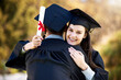 © Beaunitta V W�/peopleimages.com - Friends, hug and portrait at outdoor graduation, celebration and proud of education diploma. People, embrace and support at college or university for achievement or success, graduate and degree
