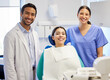 © peopleimages.com - Dentist team, portrait and patient in clinic for consultation, oral hygiene or medical procedure. Service, doctor man and nurse woman with client for teeth examination, orthodontics or dental care