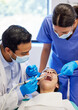 © Lumeez23/peopleimages.com - Dentist, oral care and procedure with patient for healthcare, wellness and teeth whitening in practice. Woman, ppe and dental professional with tools for consultation, cleaning and filling on chair