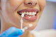 © Lumeez23/peopleimages.com - Dentist, cleaning and dental procedure for toothache in clinic, health and treatment for mouth. Teeth whitening, face and person with torque wrench machine, orthodontics and oral care for veneers