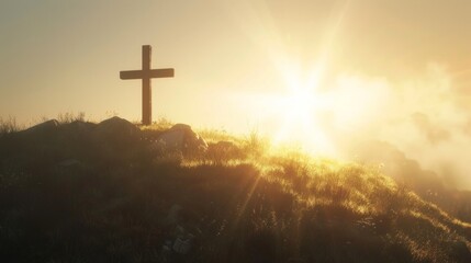 cross on top of mountain with fog and sunlight