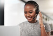 © peopleimages.com - Female person, headphones and microphone with smile on call as contact center agent or sales representative at work. Black woman, happy and consultant as virtual assistant at office in tech support