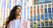 © Stock 4 You - Closeup headshot outdoor portrait of young middle eastern Israel businesswoman standing office building. Successful smiling indian or arabic woman in casual business suit looking aside. Copy space