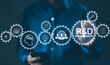 © Supatman - Businessman interacting with digital icons representing research and development (R&D) concepts, including innovation, technology, and human resources, symbolizing strategic growth and innovation.
