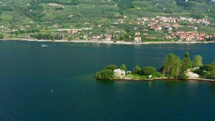 Wall Mural - Isola di Trimelone Lake Garda Aerial View with Island, Serene Blue Water and Mountains, Tranquil Summer Vacation Destination, Clear Sky and Horizon Background