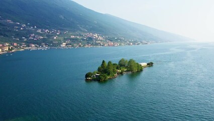 Wall Mural - Isola di Trimelone Lake Garda Aerial View with Island, Serene Blue Water and Mountains, Tranquil Summer Vacation Destination, Clear Sky and Horizon Background