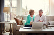 © Reese Coop/peopleimages.com - Documents, laptop and old couple on sofa with financial budget, insurance and investment in home. Retirement, marriage and mature man and woman on computer for finance, online banking or savings