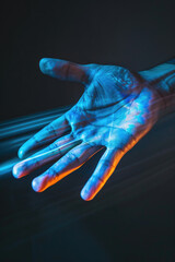 Wall Mural - A close-up image of a hand reaching out, bathed in blue and orange light streaks, against a dark background